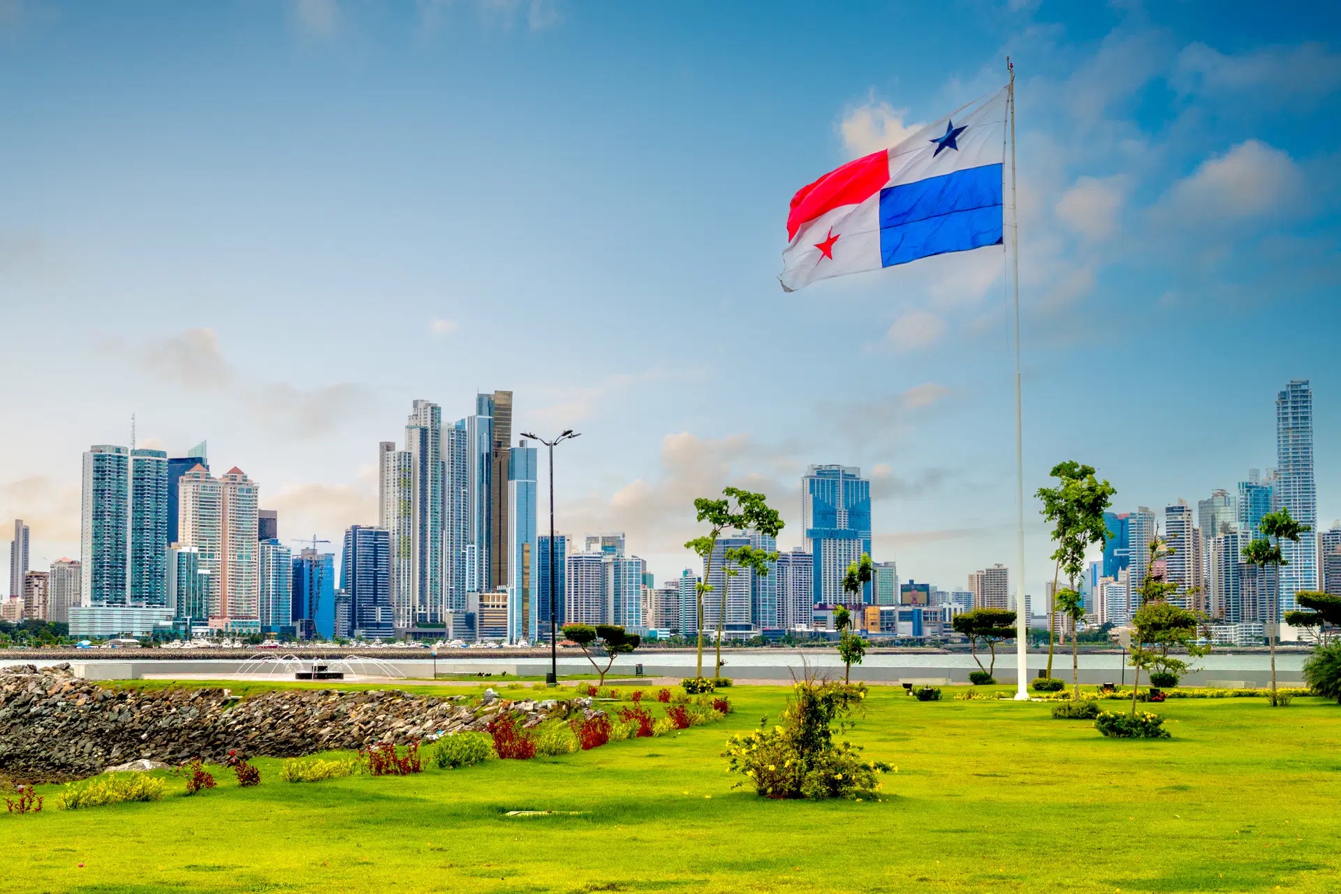 Panama City skyline with the Panamanian flag